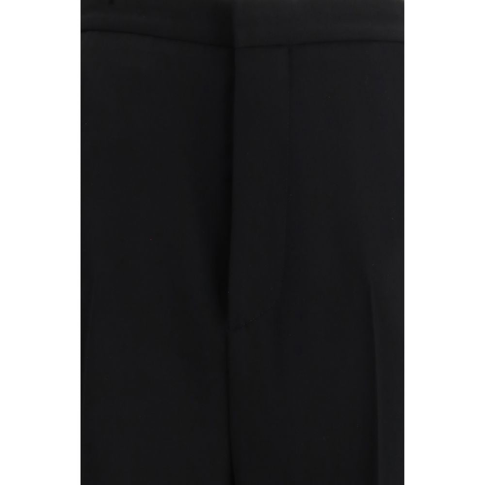 Trousers by Balenciaga for women in cotton black features an sartorial silhouette, showcasing a precise regular-fit and long with a sartorial for a refined look.
