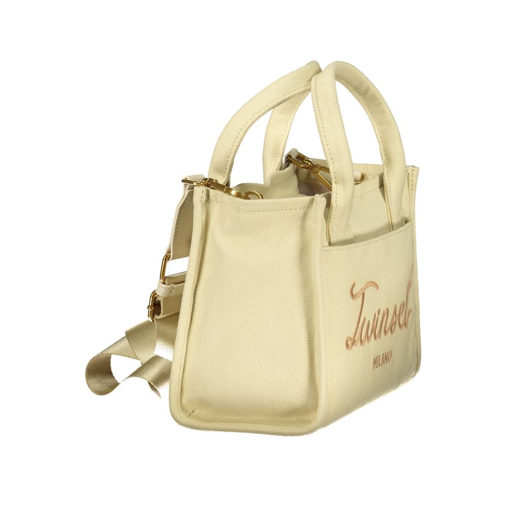 Tote Handbag by Twinset for women in cotton beige features an refined silhouette, showcasing a secure zipper, ample external-pockets & internal-pockets, and versatile shoulder-strap, handle & adjustable-strap for a sophisticated refined aesthetic.