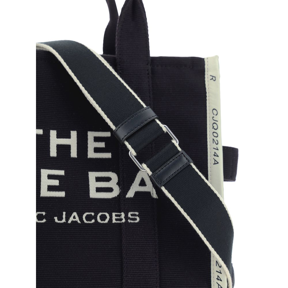 Medium Tote Handbag by Marc Jacobs for women in cotton polyester black, jacquard, monogram & print features a refined silhouette, showcasing a secure zipper, organized , and versatile shoulder-strap, handle & adjustable-strap for a refined finish.