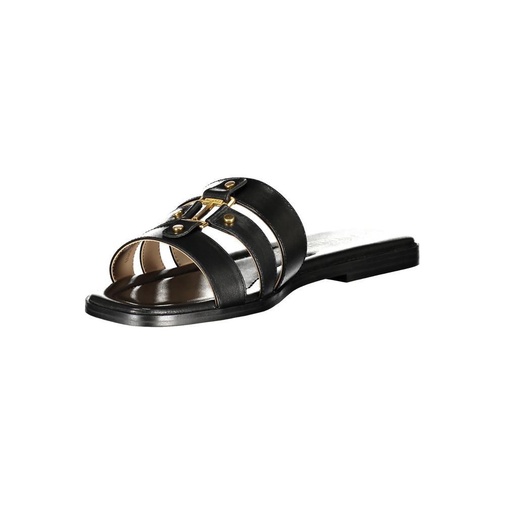 Flat Sandals by Twinset for women in polyurethane leather and black presents a sculptural silhouette, showcasing the signature style of the Essence Women's Polyurethane Leather Flat Sandals with a sculptural flat and sculptural .
