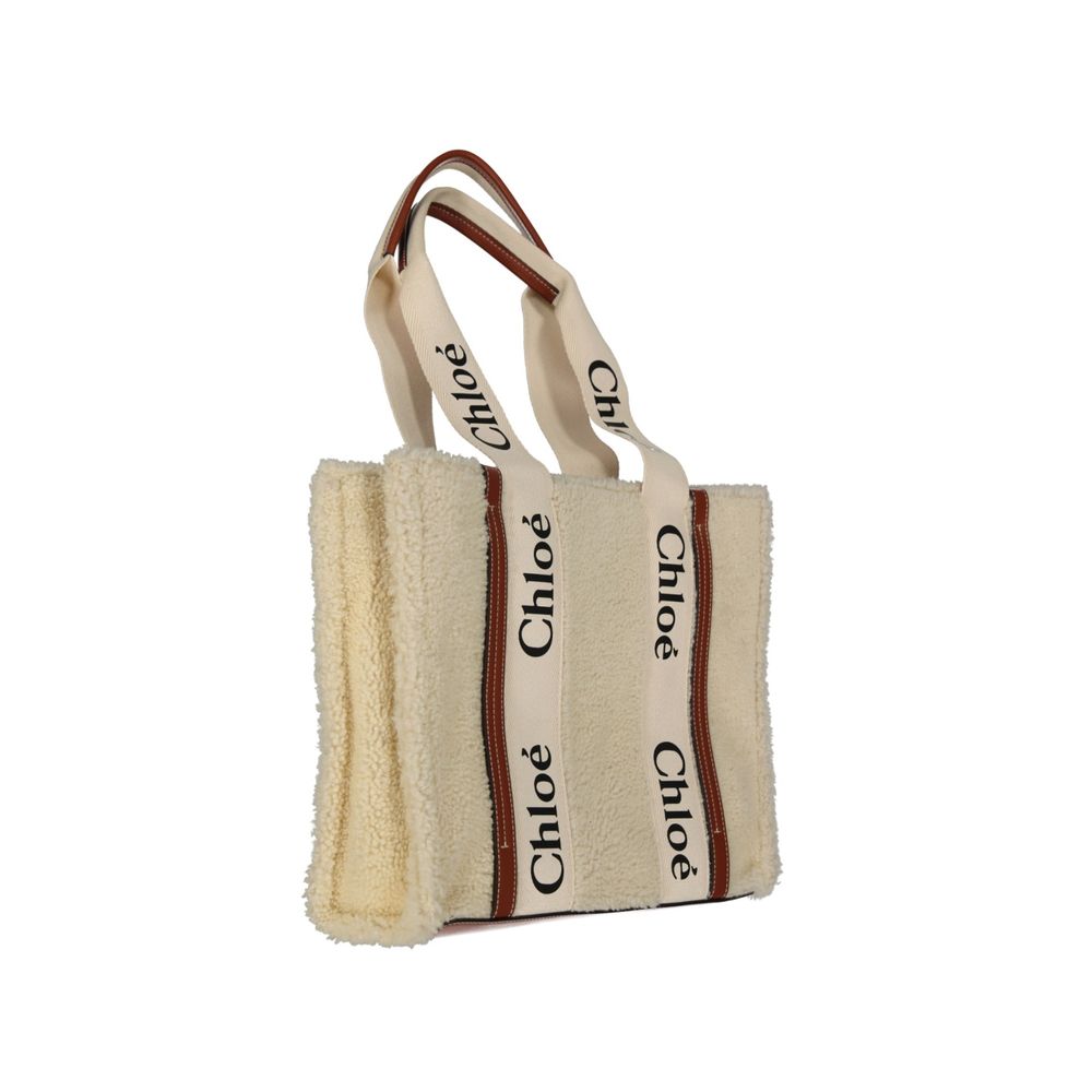 This Tote Bag by Chloé for women in fur beige & signature features an jet-set Fur Tote Bag design with a secure , ample , and jet-set handle.