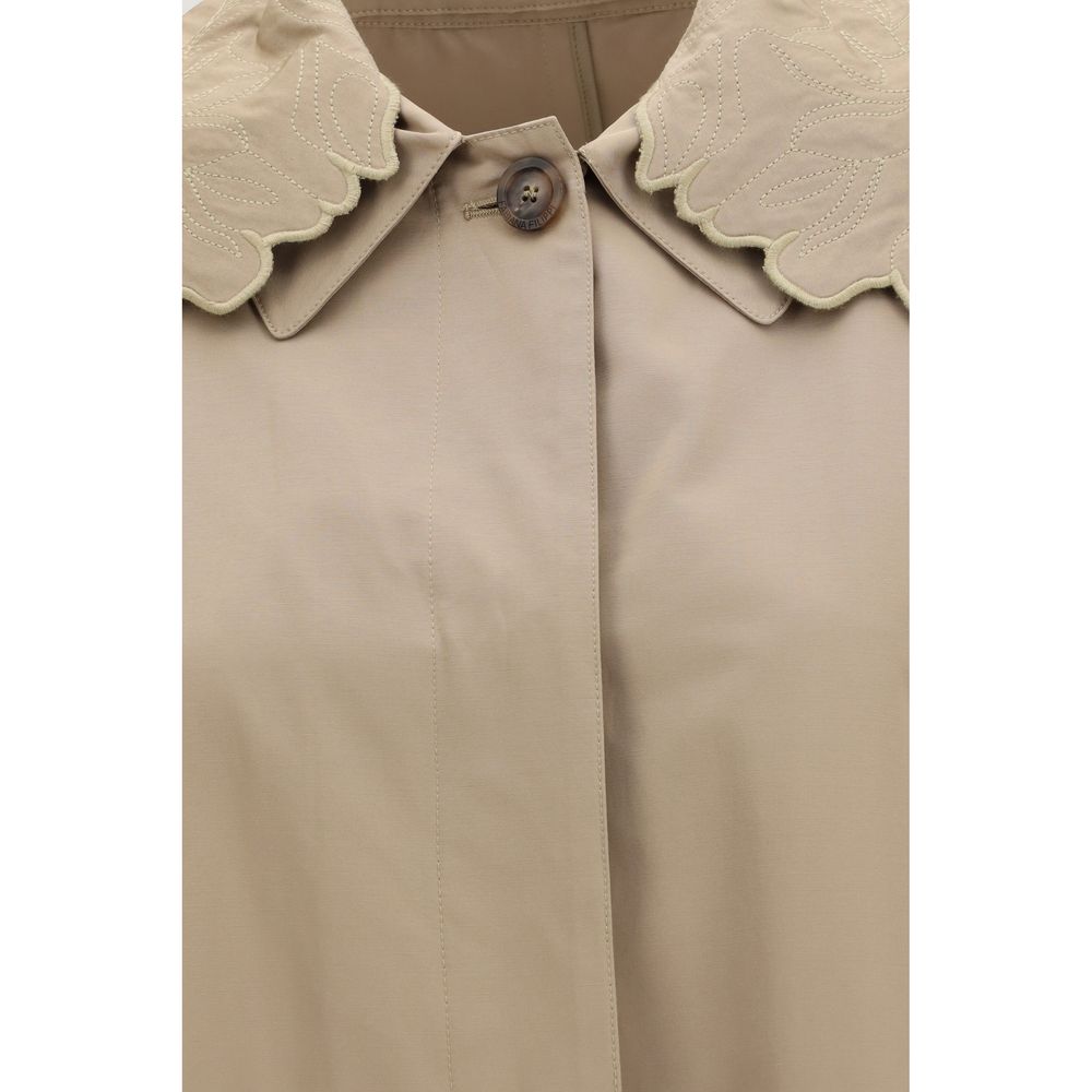 Trench Coat by Fabiana Filippi for women in cotton polyester beige presents a utilitarian silhouette, showcasing a utilitarian and sophisticated insulated for a truly utilitarian look.