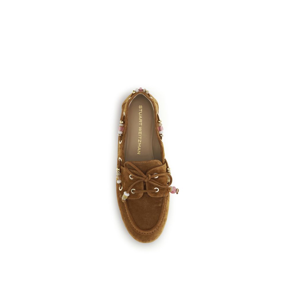 Flat Boat Loafer Slip-On Shoes by Stuart Weitzman for women in bos taurus calf leather brown features an dynamic silhouette from the Women's Bos Taurus Calf Leather Flat Boat Loafer Slip-On Shoes collection, defined by a dynamic almond toe style and flat for a dynamic look.