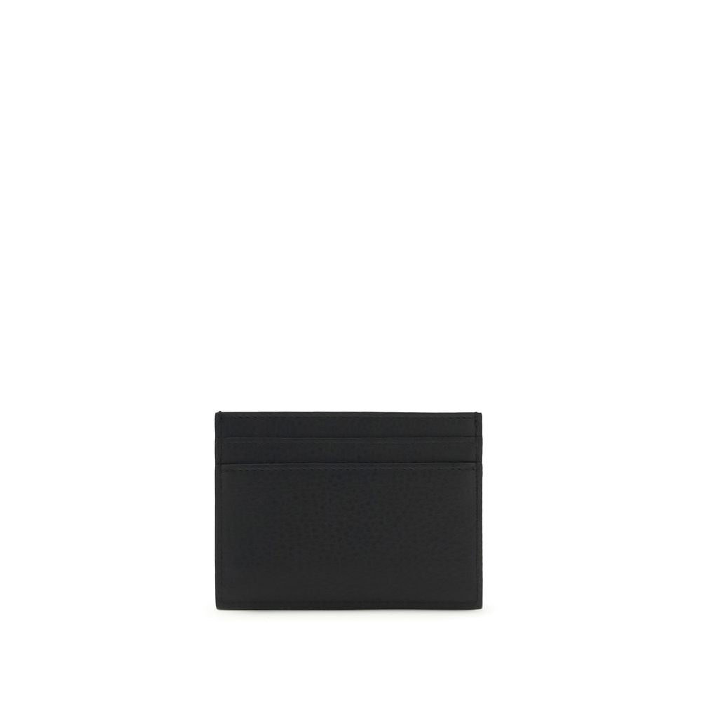 Cardholder Wallet by Saint Laurent for men in bos taurus calf grained leather black & silver showcases a discerning silhouette, artfully capturing the essence of Cassandre Bos Taurus Calf Grained Leather Cardholder Wallet with its functional card-organization compact-design.
