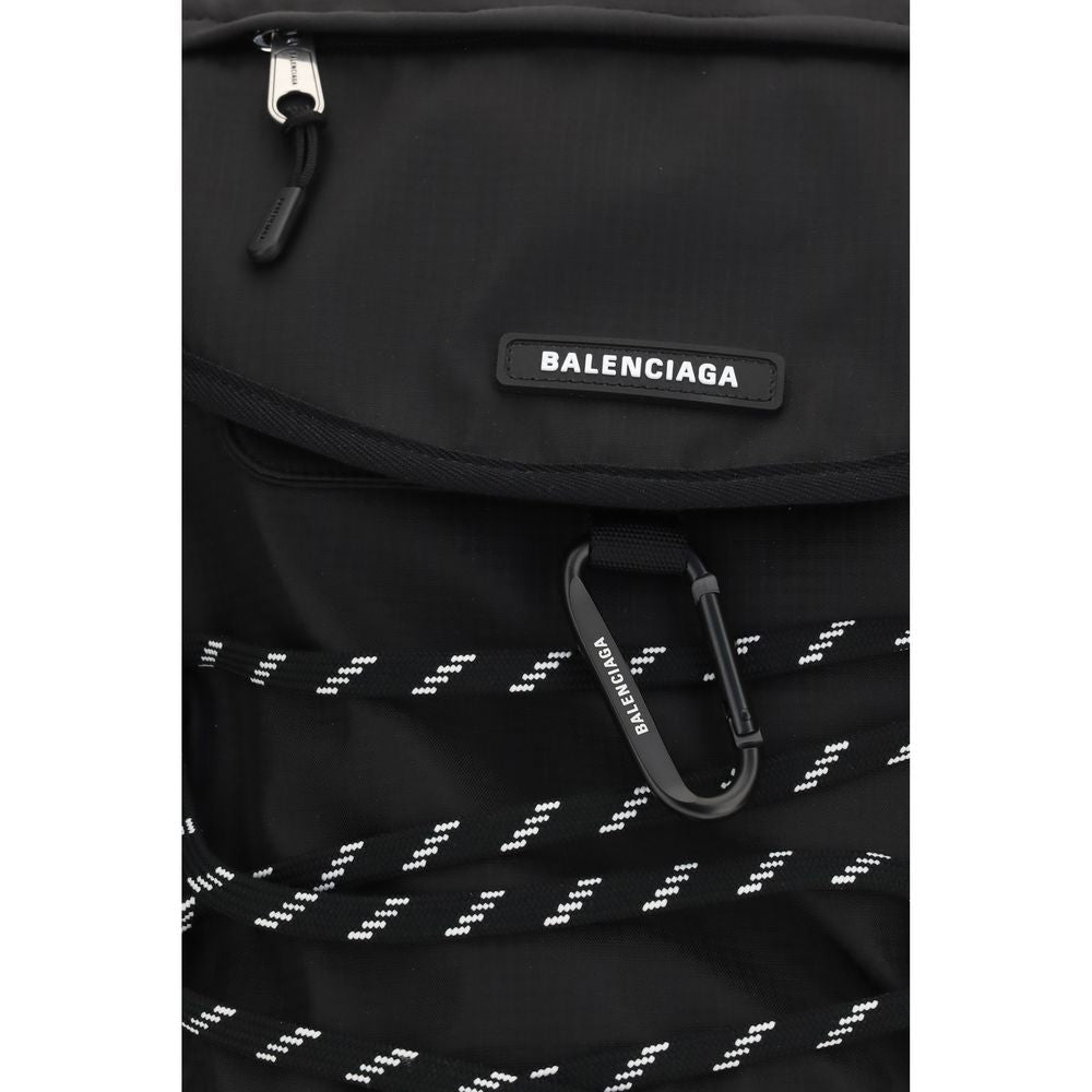 Small Flap Backpack Shoulder Bag by Balenciaga for men in mesh black features a stately silhouette, showcasing a secure flap & zipper, ample external-pockets, and stately shoulder-strap, handle, backpack-strap & adjustable-strap for a stately finish.