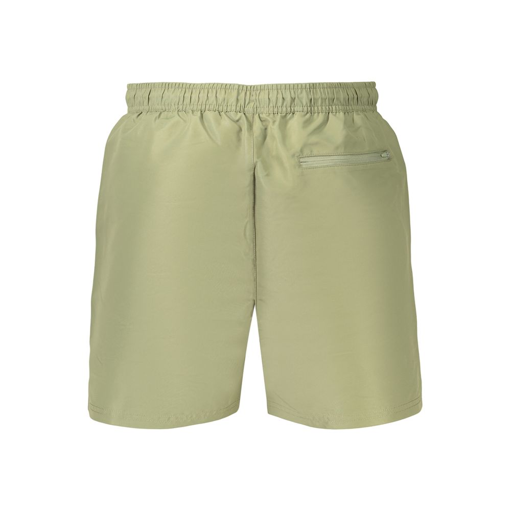 Swim Shorts by Calvin Klein for men in polyester and green & print showcases a sinuous silhouette, expertly cut for a sinuous fit as part of the Men's Polyester Swim Shorts collection.