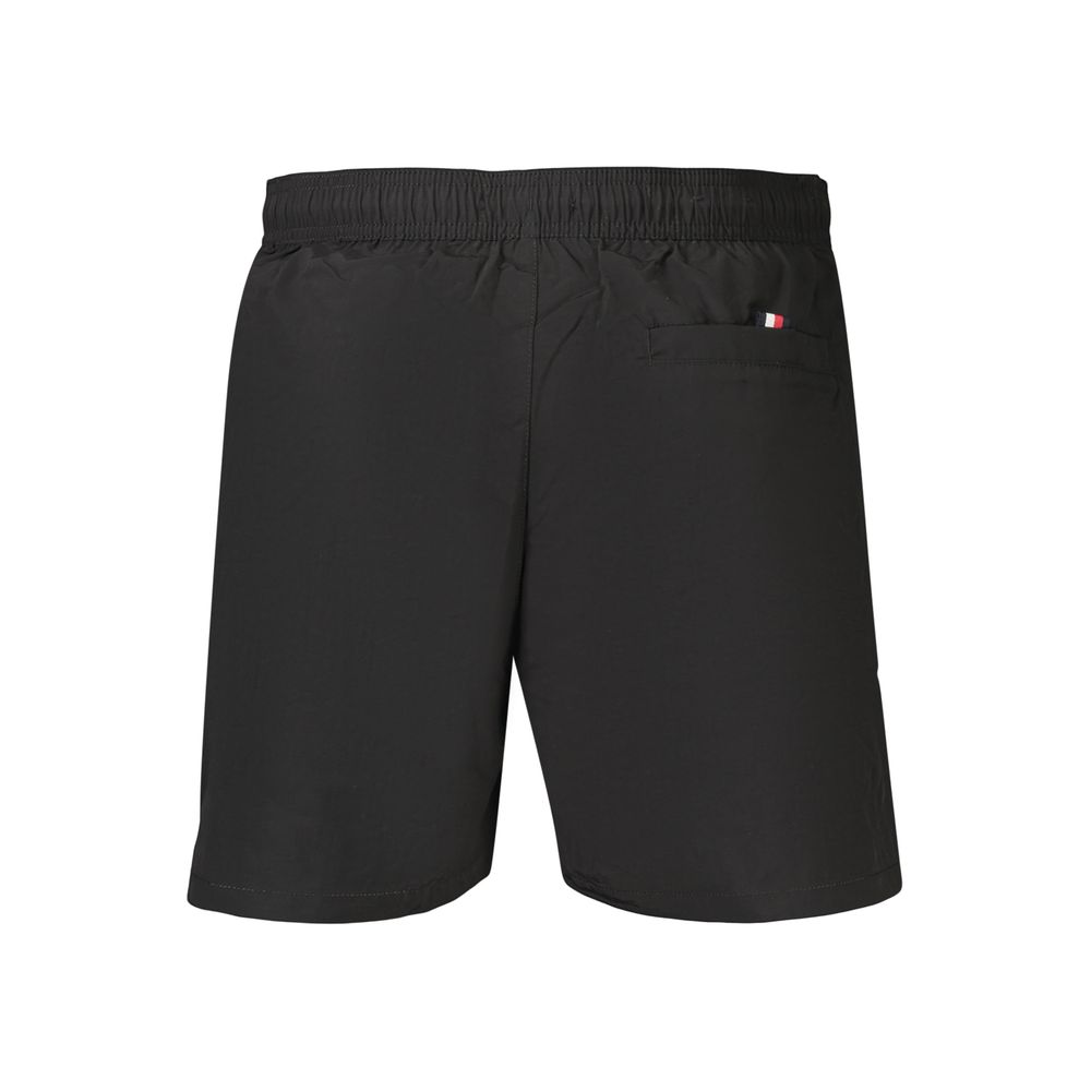 Swim Shorts by Tommy Hilfiger for men in polyester black showcases a sculptural silhouette, expertly capturing the sophisticated essence of the sculptural Men's Polyester Swim Shorts design for a premium poolside look.