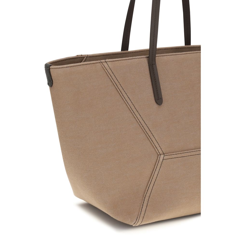 This Shoulder Trapeze Handbag by Brunello Cucinelli for women in cotton polyester canvas and beige presents a sculptural silhouette featuring a secure , ample , and versatile shoulder-strap & handle for a sculptural finish.