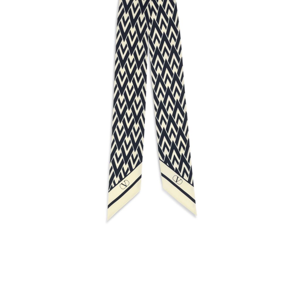 Scarf by Valentino Garavani for women in silk twill blue & print showcases a warm silhouette from the Silk Twill Scarf collection, offering a warm drape that exudes sophisticated luxury.