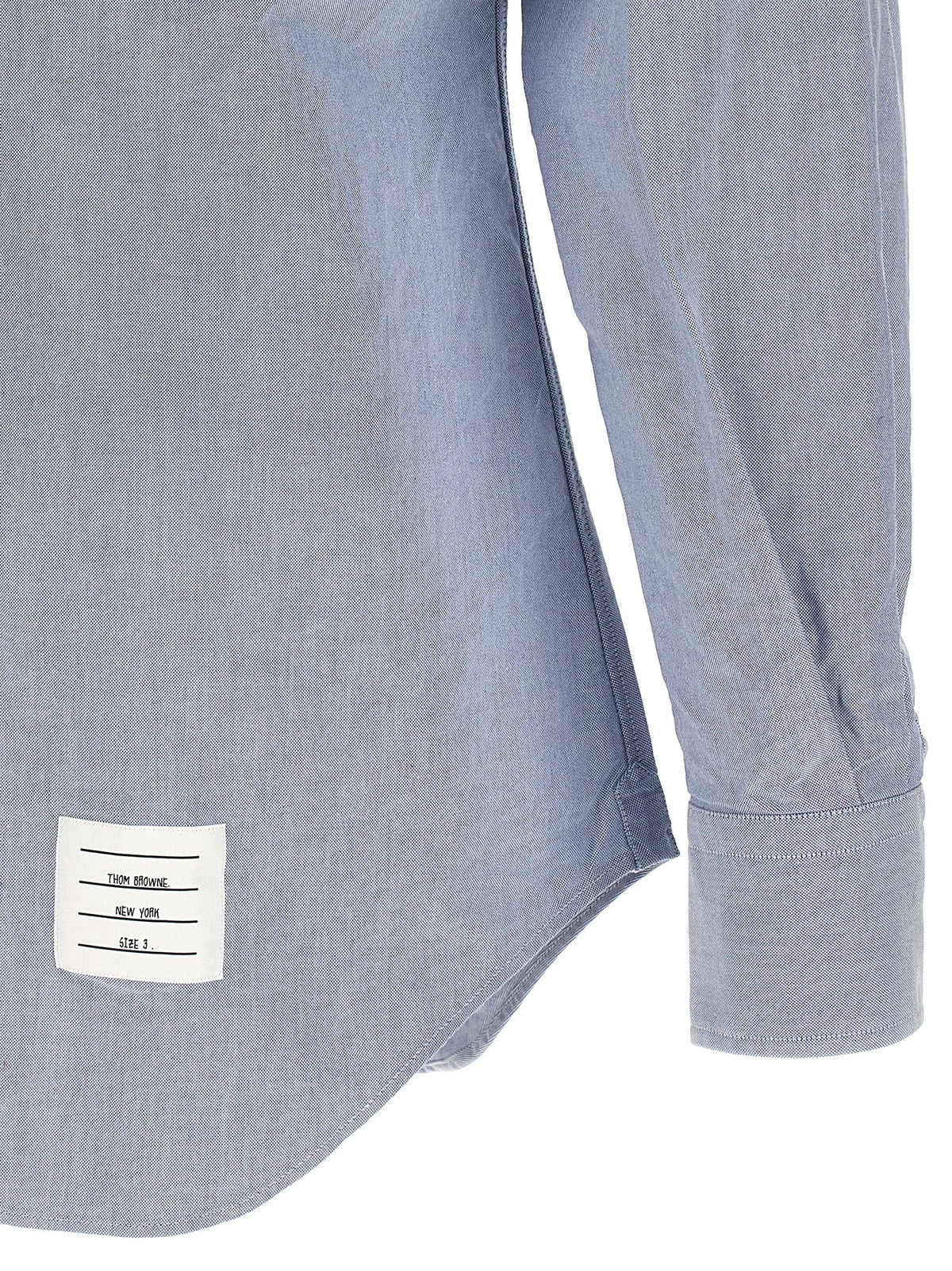 Shirt by Thom Browne for men in cotton light-blue showcases a sleek silhouette, elegantly detailed with a sleek and for a sleek finish.