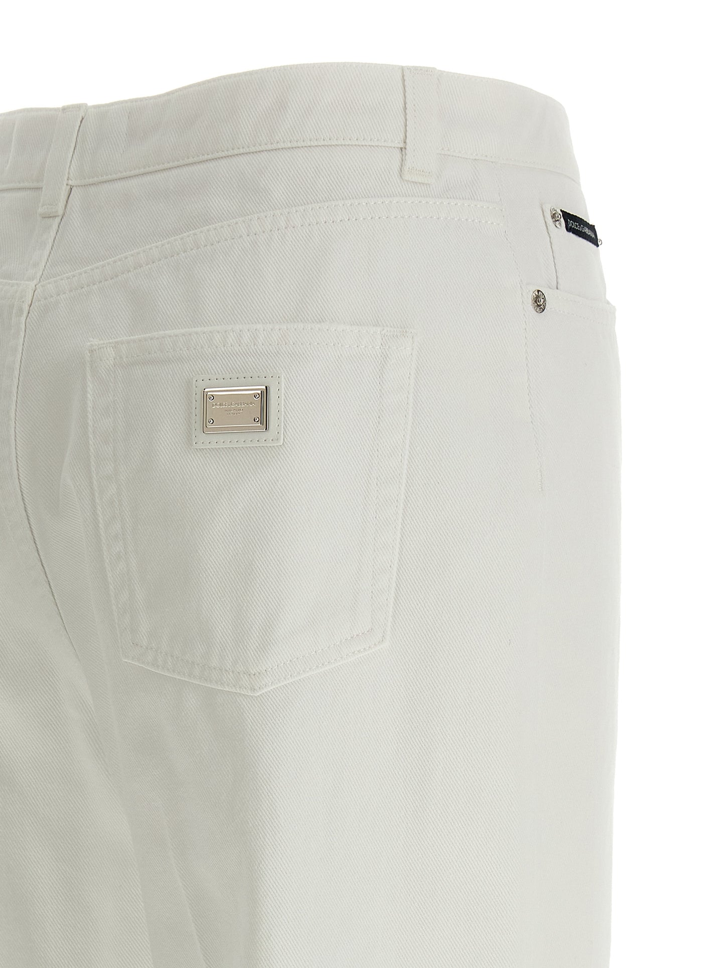 Jeans by Dolce & Gabbana for women in denim cotton white presents a refined pantology silhouette, artfully defined by a refined pantology flared, regular-fit & wide, long, and a sophisticated .