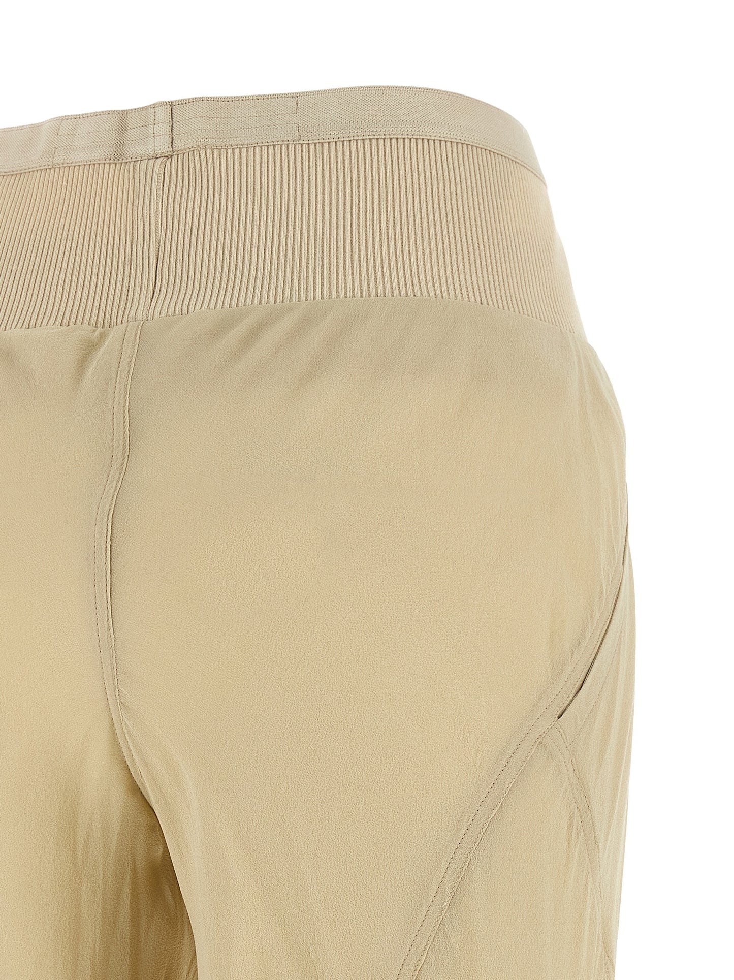 Trousers by Rick Owens for women in silk beige & transparent features a artisanal silhouette, showcasing a sophisticated flared & wide with a long and for a artisanal finish.