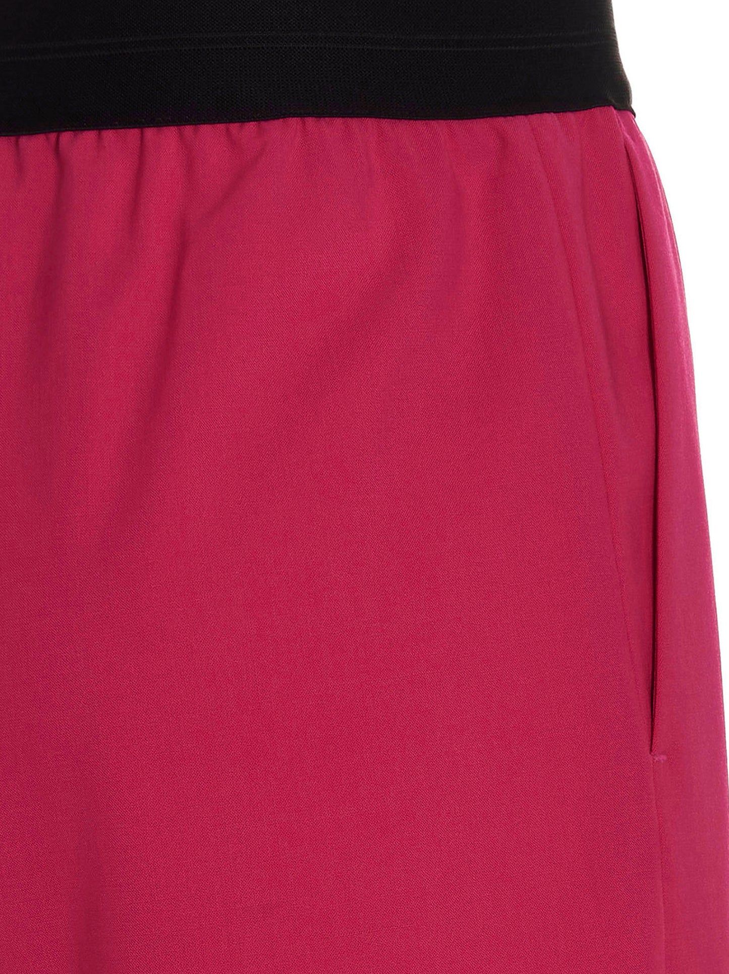 Bermuda Shorts by MSGM for women in virgin wool fuchsia presents a sleek silhouette, featuring a sleek with a refined short and a sophisticated .