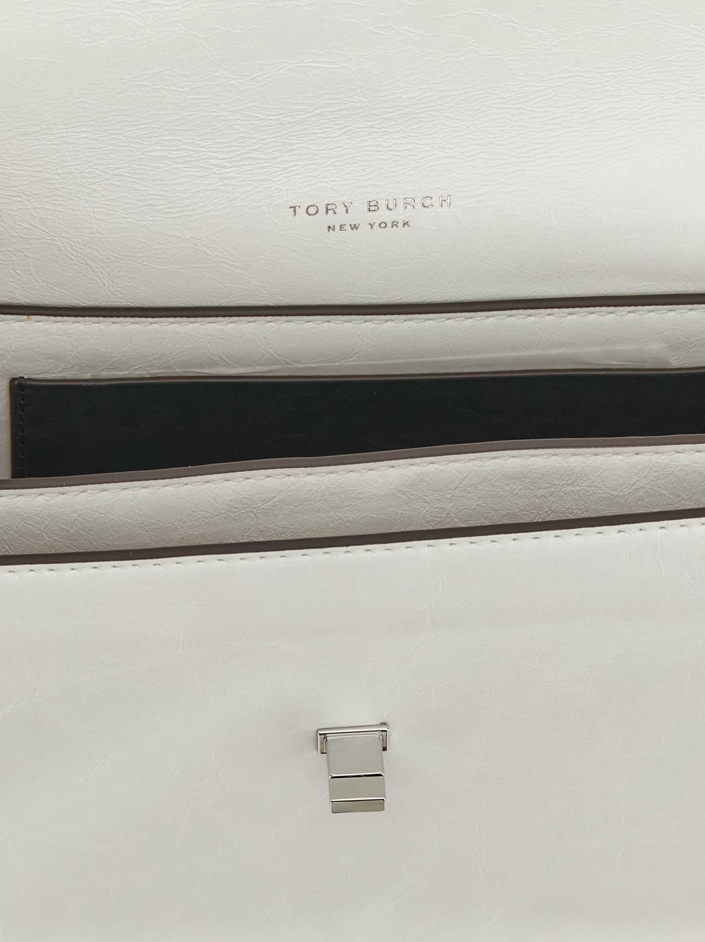 Shoulder Flap Bag by Tory Burch for women in lamb leather white features an effortlessly chic silhouette with a secure snap & flap, ample , and versatile shoulder-strap for effortlessly chic everyday luxury.