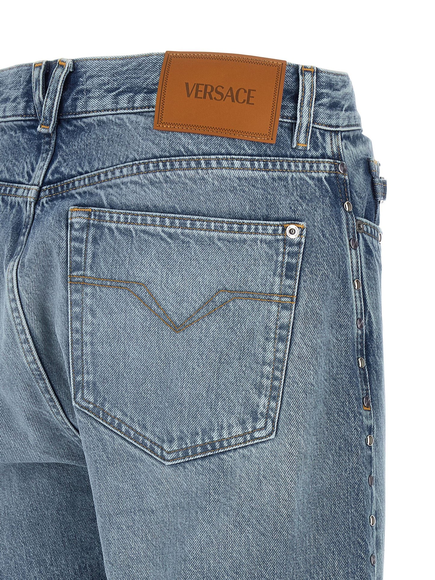 Jeans by Versace for men in denim cotton blue features an sartorial straight-leg and long with a cut for a sartorial finish.