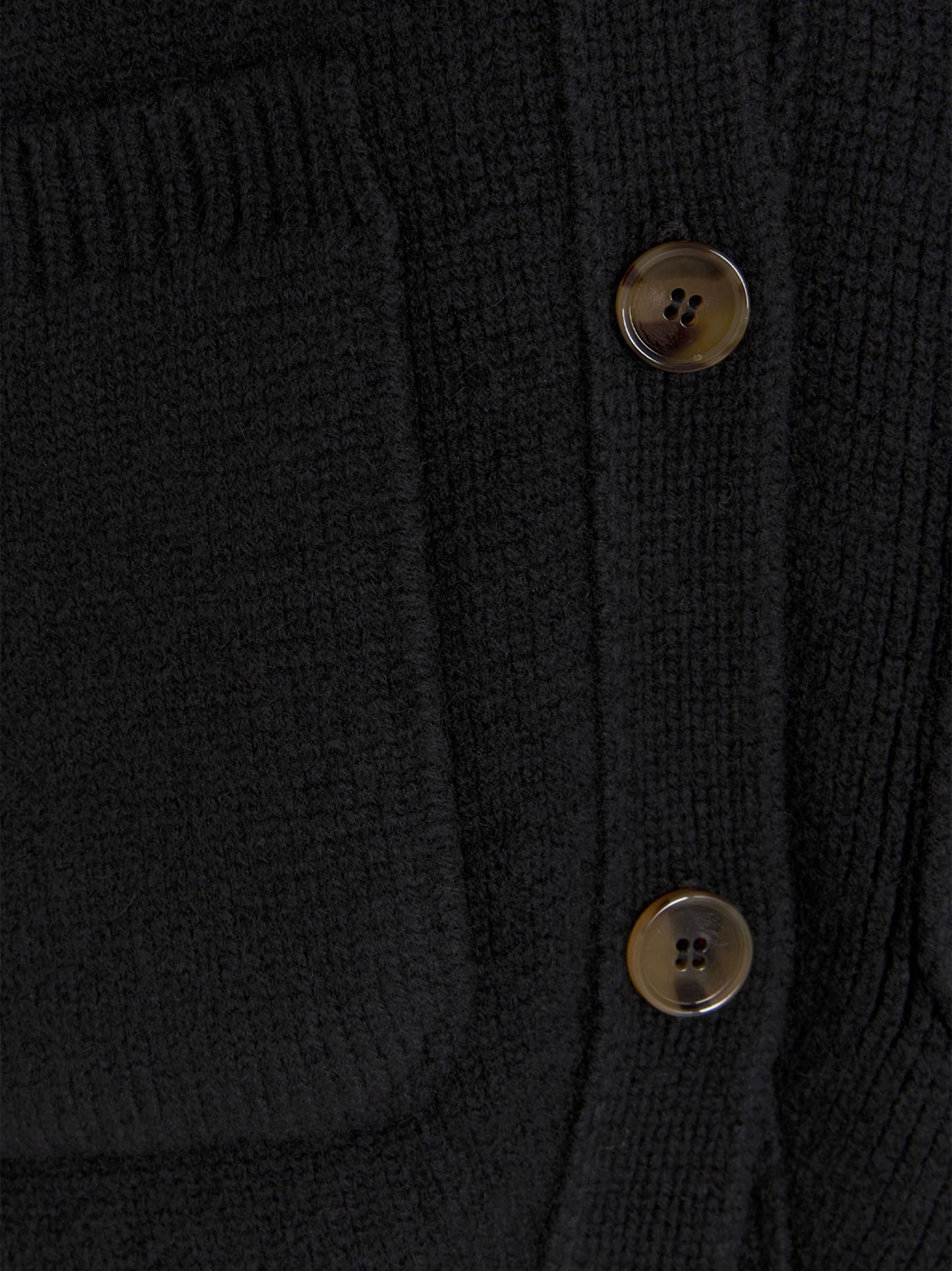 Cardigan by Khaite for women in cashmere black features a dramatic silhouette, showcasing a sophisticated and dramatic detail for a timeless, premium look.