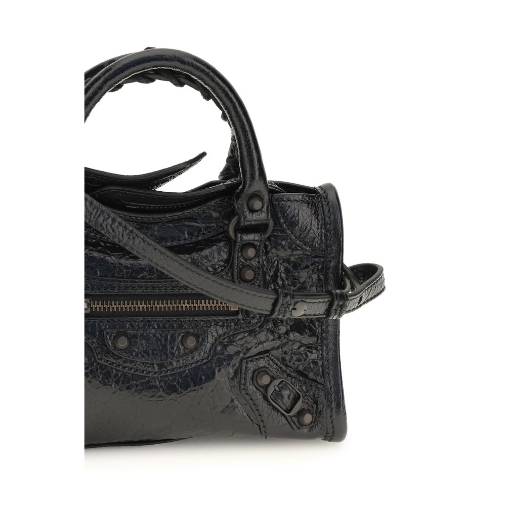 Compact Handbag by Balenciaga for women in lambskin leather black features an refined silhouette, showcasing a secure zipper, ample , and versatile shoulder-strap, adjustable-strap & handle for a sophisticated refined aesthetic.