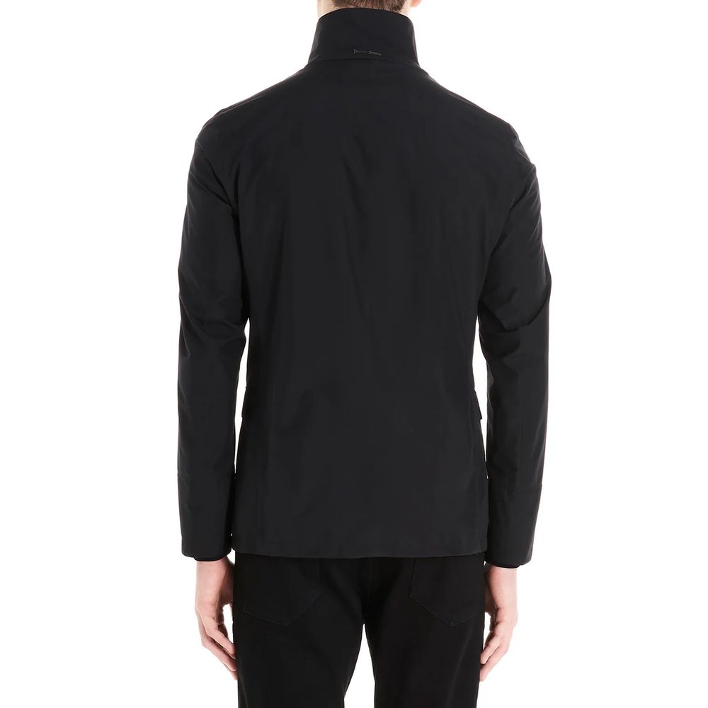 Jacket by Herno for men in polyester black presents a impeccable silhouette, showcasing distinct pockets and a impeccable for a sophisticated finish.