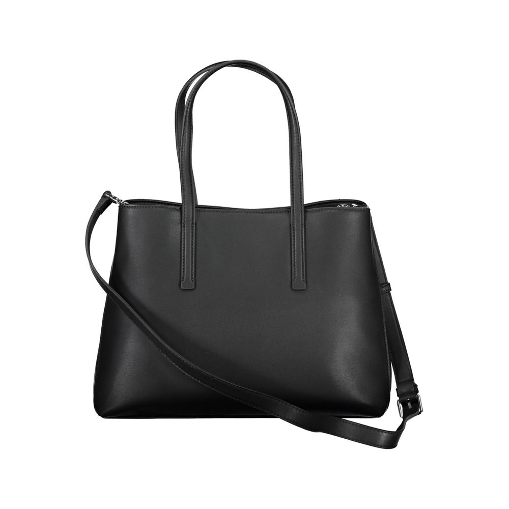 Handbag by Calvin Klein for women in polyester & polyurethane black features a refined silhouette, showcasing a secure , organized built-in-compartments & document-holder, and versatile shoulder-strap, handle & detachable-strap for a refined finish.