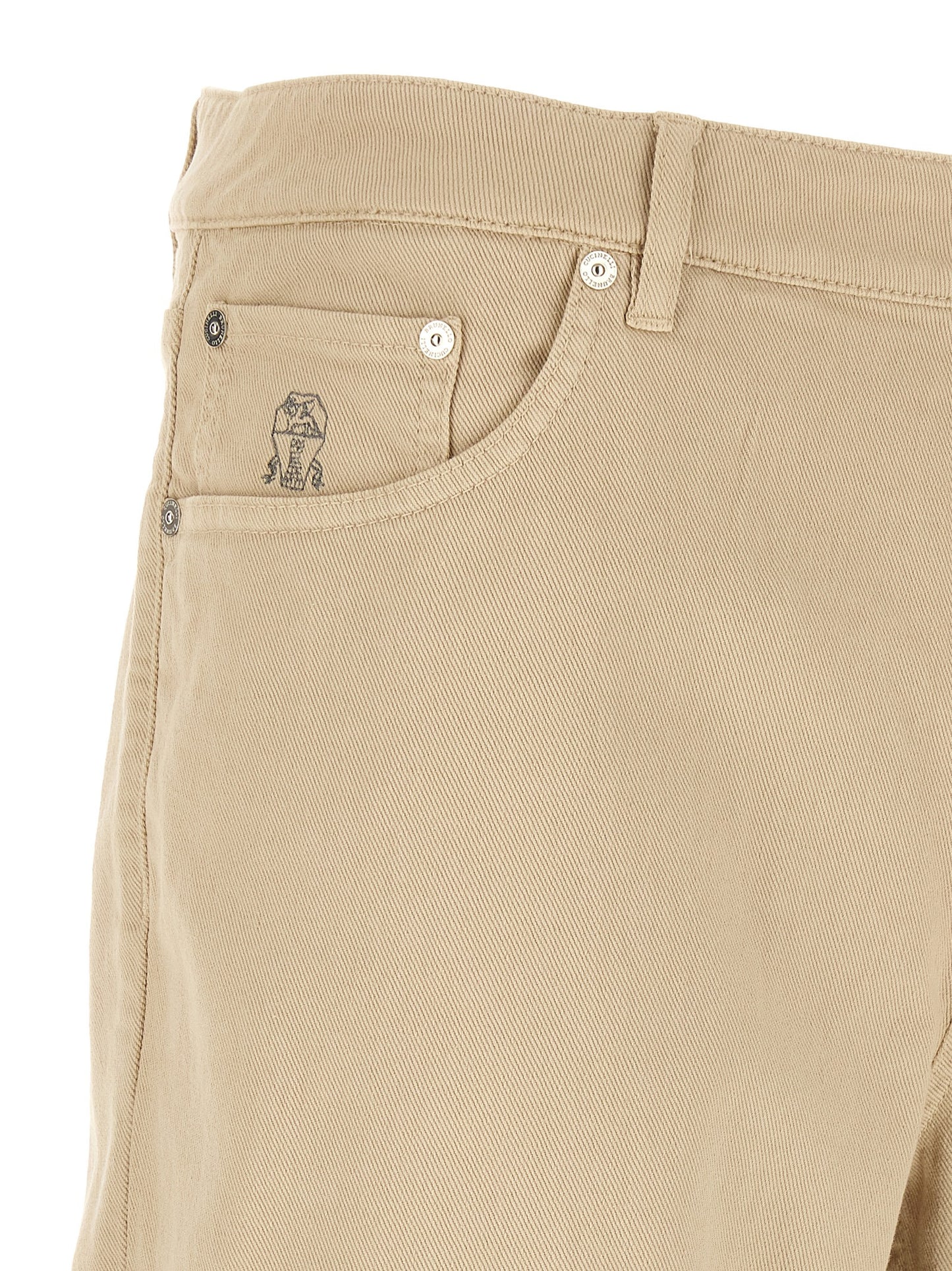 Jeans by Brunello Cucinelli for men in stretch denim cotton beige, sand & signature features an sophisticated and tapered-leg with a precise long, creating a sophisticated and sophisticated silhouette.