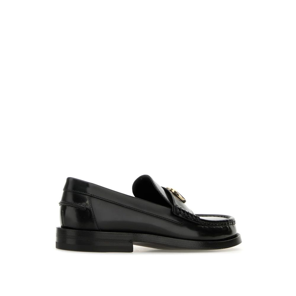 Flat Loafer Slip-On Shoes by Gucci for women in leather black & gold features an ergonomic silhouette, perfectly showcasing Gg Women's Leather Flat Loafer Slip-On Shoes with its distinct flat and elegant round toe style.