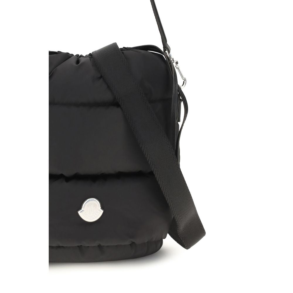 Bucket Handbag by Moncler for women in leather & metal black & signature features a effortlessly chic silhouette, showcasing a secure drawstring, ample , and versatile shoulder-strap & handle for a effortlessly chic look.
