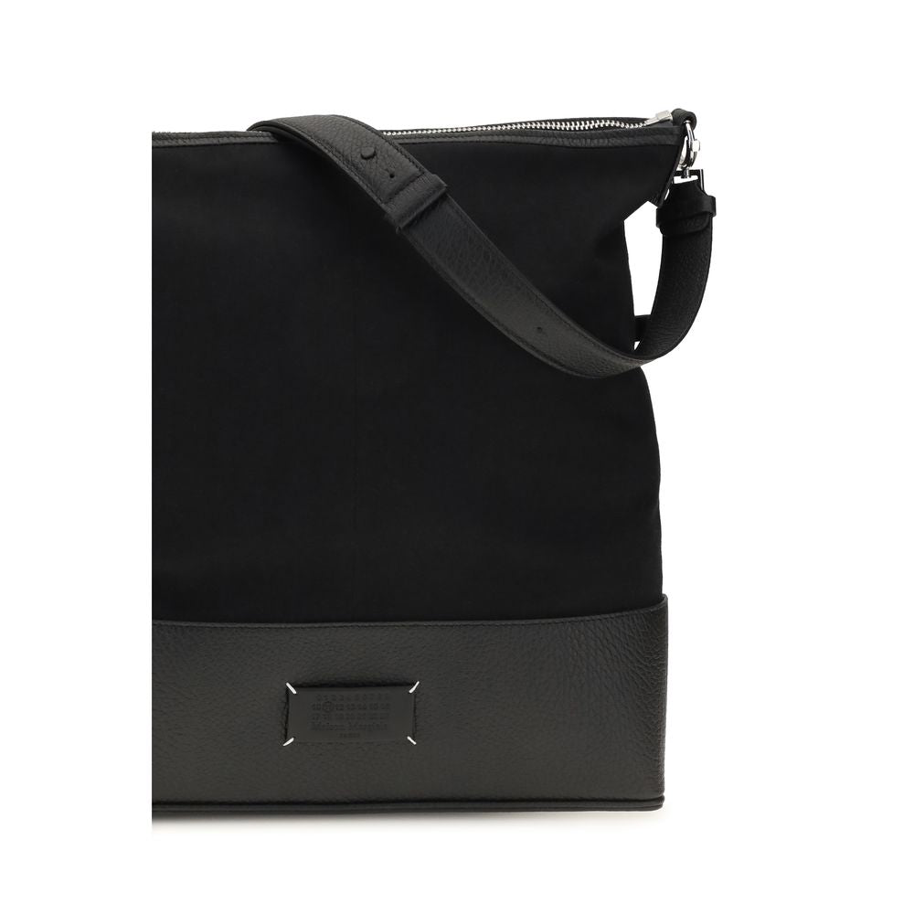 Medium Shoulder Hobo Bag by Maison Margiela for men in bos taurus calf leather black features a effortless chic silhouette with a secure zipper, ample , and versatile shoulder-strap & adjustable-strap for a effortless chic finish.