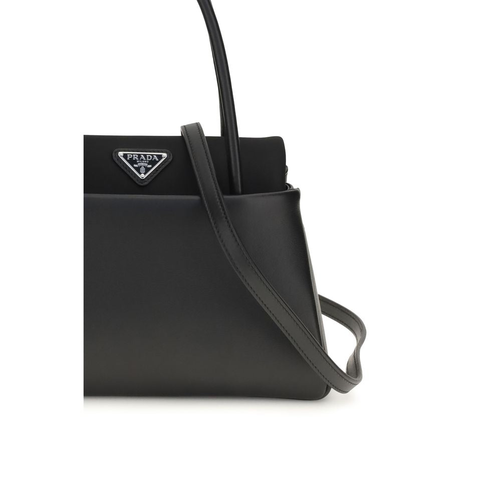 Compact Handbag by Prada for women in bos taurus calfskin leather black & signature features a signature silhouette, showcasing a secure and signature with versatile shoulder-strap, handle & detachable-strap for a sophisticated look.