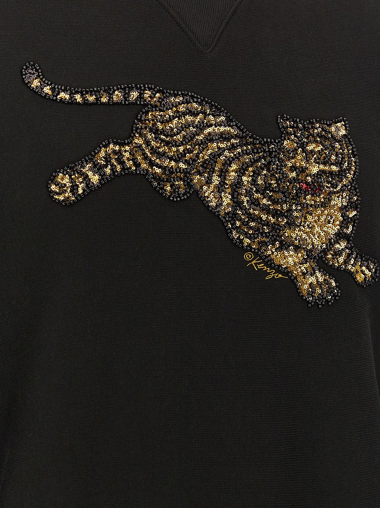 Sweatshirt by Kenzo for men in cotton sequins black features an magnificent silhouette, showcasing a sophisticated and detail for a truly magnificent finish.