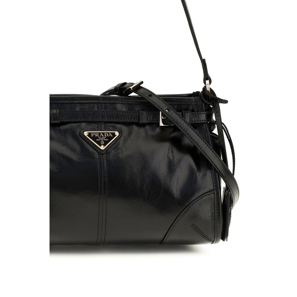 Small Shoulder Hobo Handbag by Prada for women in bos taurus calf leather black features an refined silhouette, showcasing a secure zipper, ample , and versatile shoulder-strap, handle, adjustable-strap, detachable-strap & belt-strap for a sophisticated refined aesthetic.