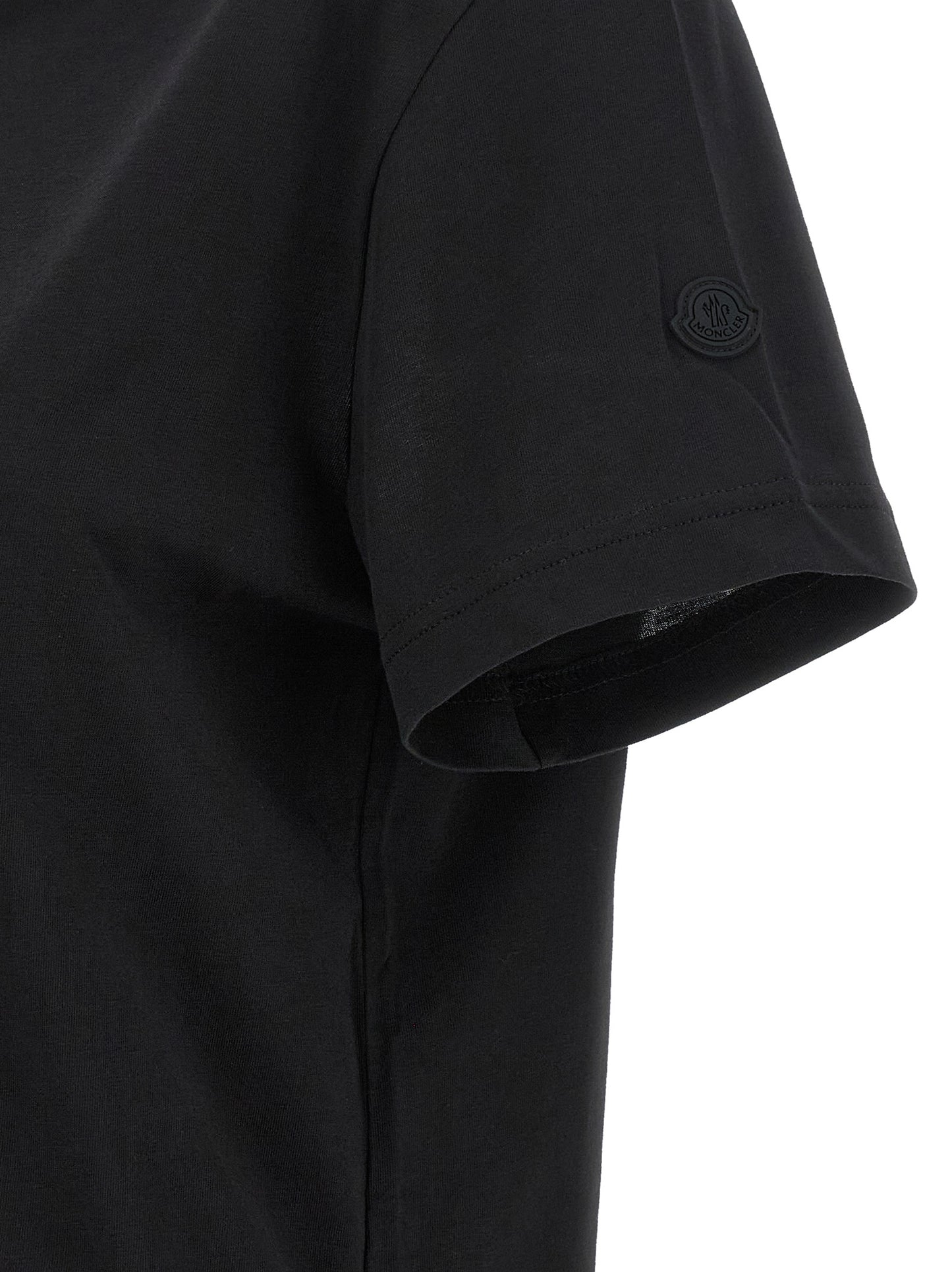 T-Shirt by Moncler for women in cotton black showcases a unassuming silhouette, artfully detailed with a refined and unassuming for a sophisticated, contemporary look.