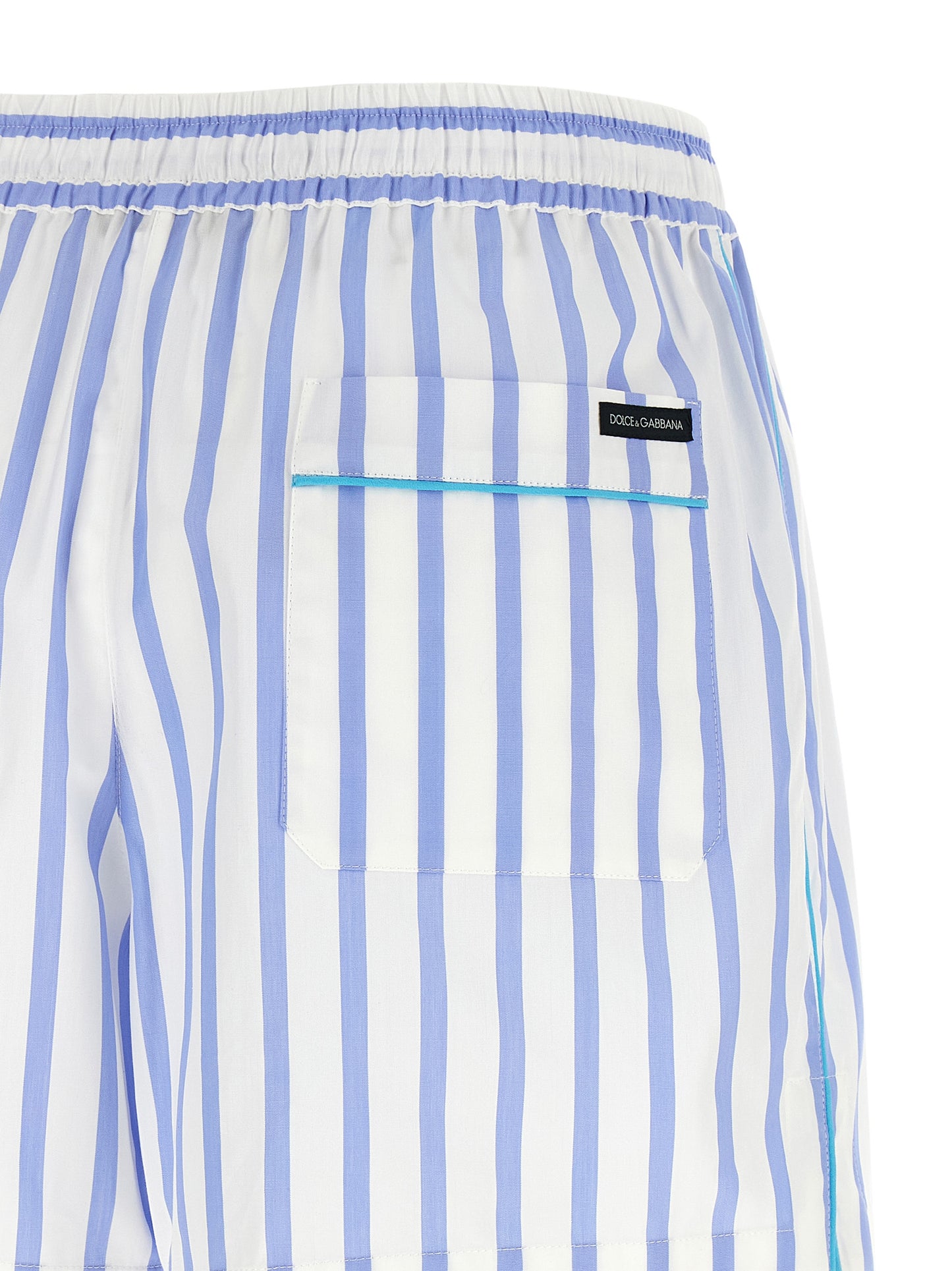 Bermuda Shorts by Dolce & Gabbana for women in cotton & silk light-blue, white, signature & striped presents a contemporary silhouette, showcasing a contemporary relaxed-fit with a refined short and elegant .