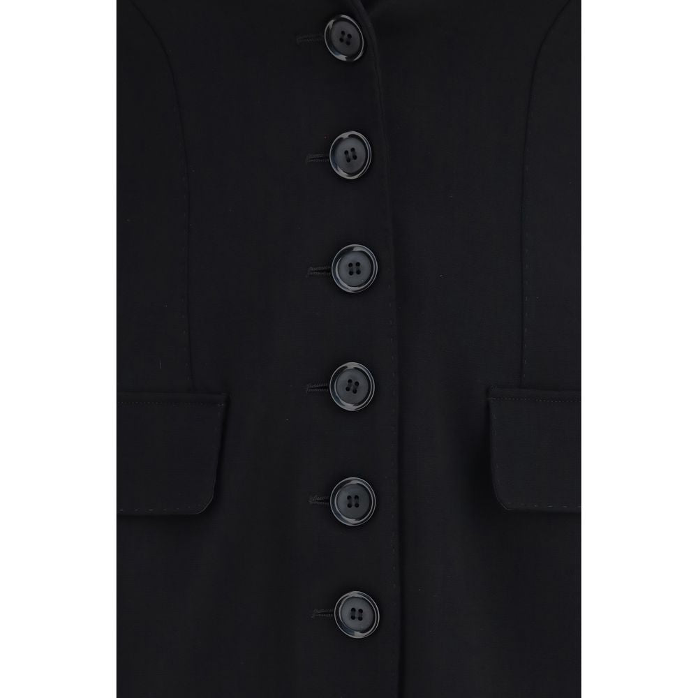 Overcoat by Dolce & Gabbana for women in wool & elastane black features an voluminous silhouette, showcasing distinct pockets and a voluminous for a truly voluminous aesthetic.