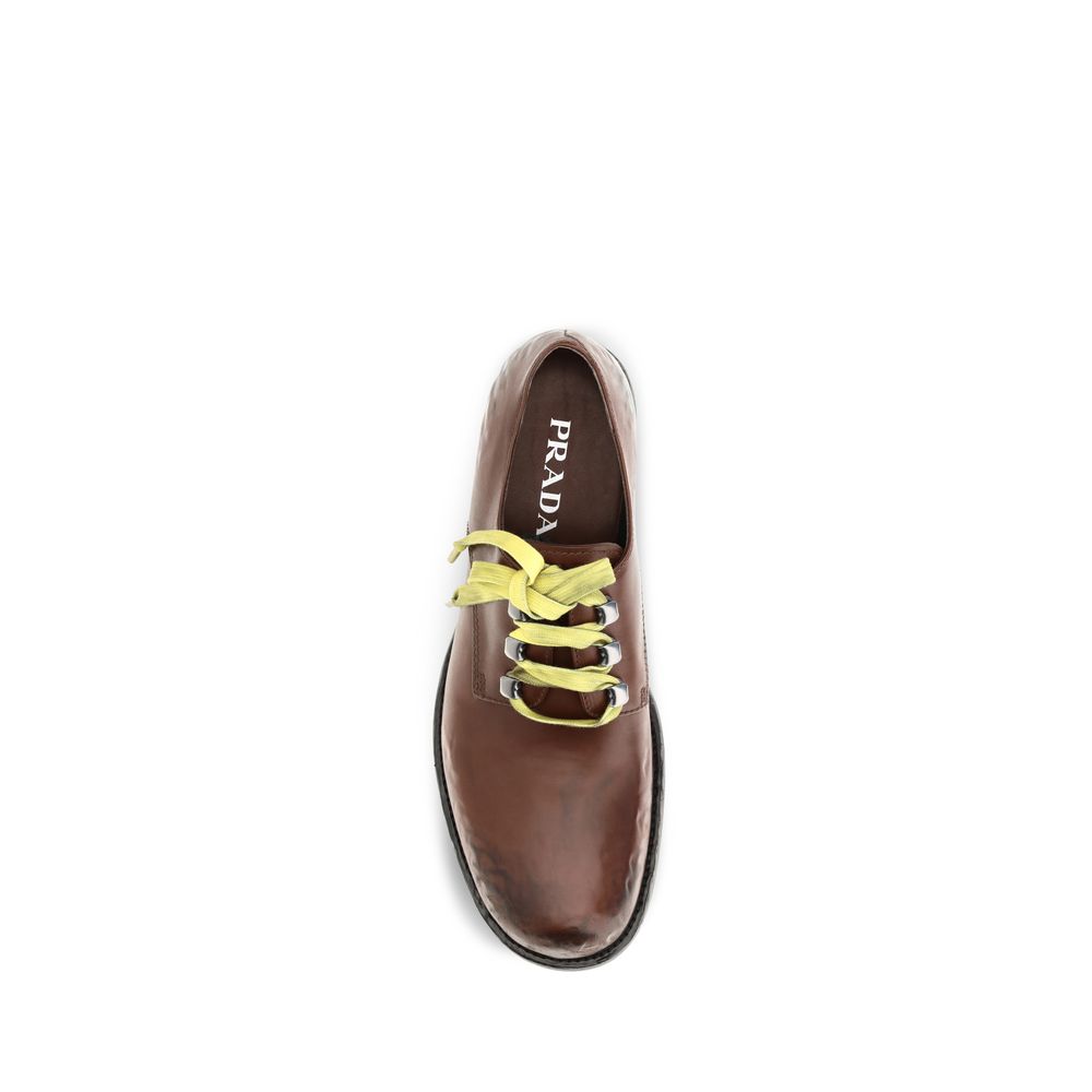 This Flat Loafer Slip-On Lace-Up Shoes by Prada for women in bos taurus calf leather brown features an exquisite silhouette from the Women's Bos Taurus Calf Leather Flat Loafer Slip-On Lace-Up Shoes collection, defined by a sophisticated flat and elegant .
