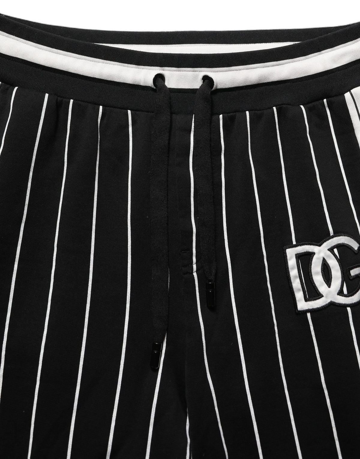 Jogger Sweatpants by Dolce & Gabbana for men in cotton black, white, pinstripe & striped features an dynamic with long, , and functional for an dynamic silhouette.