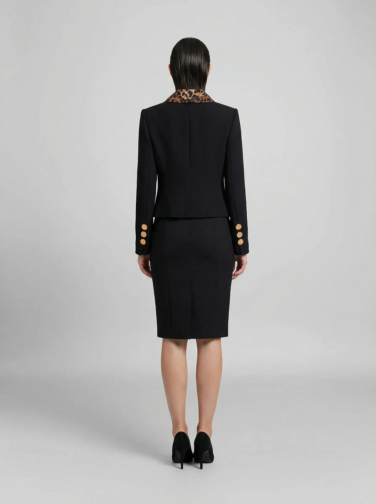 Overcoat by Dolce & Gabbana for women in virgin wool silk polyester & metallized fiber black showcases a enveloping silhouette, detailed with distinctive and a enveloping .