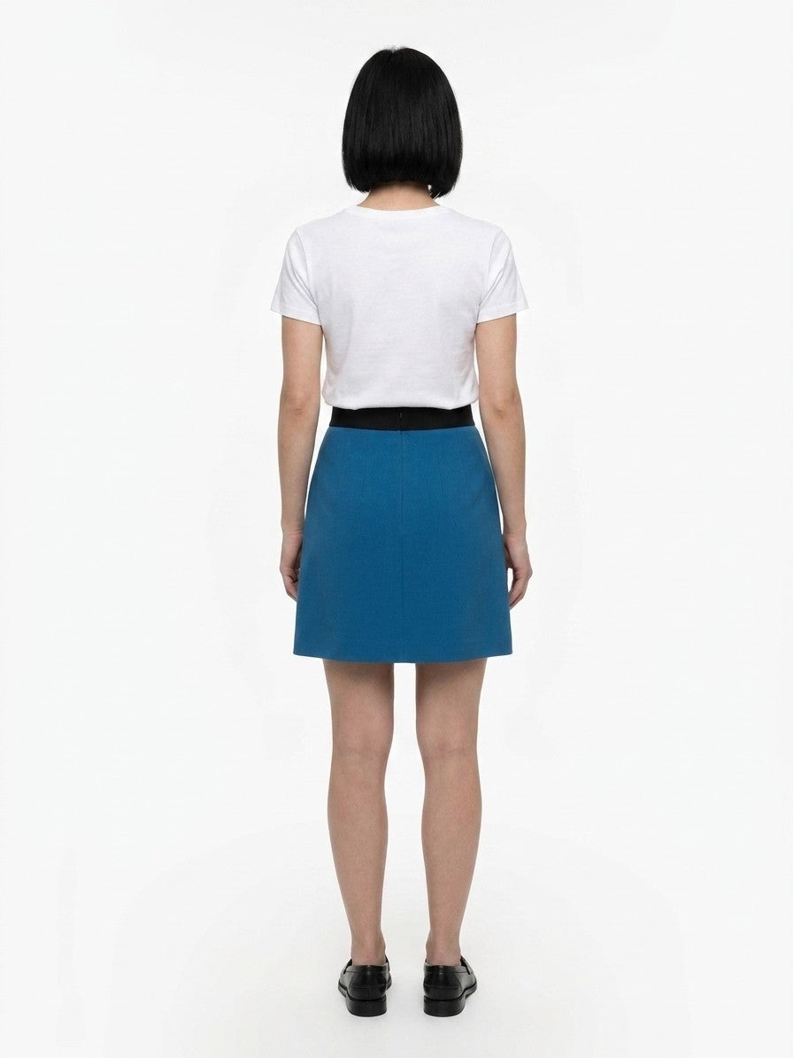 Skirt by Dolce & Gabbana for women in silk wool & elastane teal showcases a sultry silhouette, elegantly defined by its mini and the sophisticated sultry design of the Women's Silk Wool & Elastane Mini Skirt.
