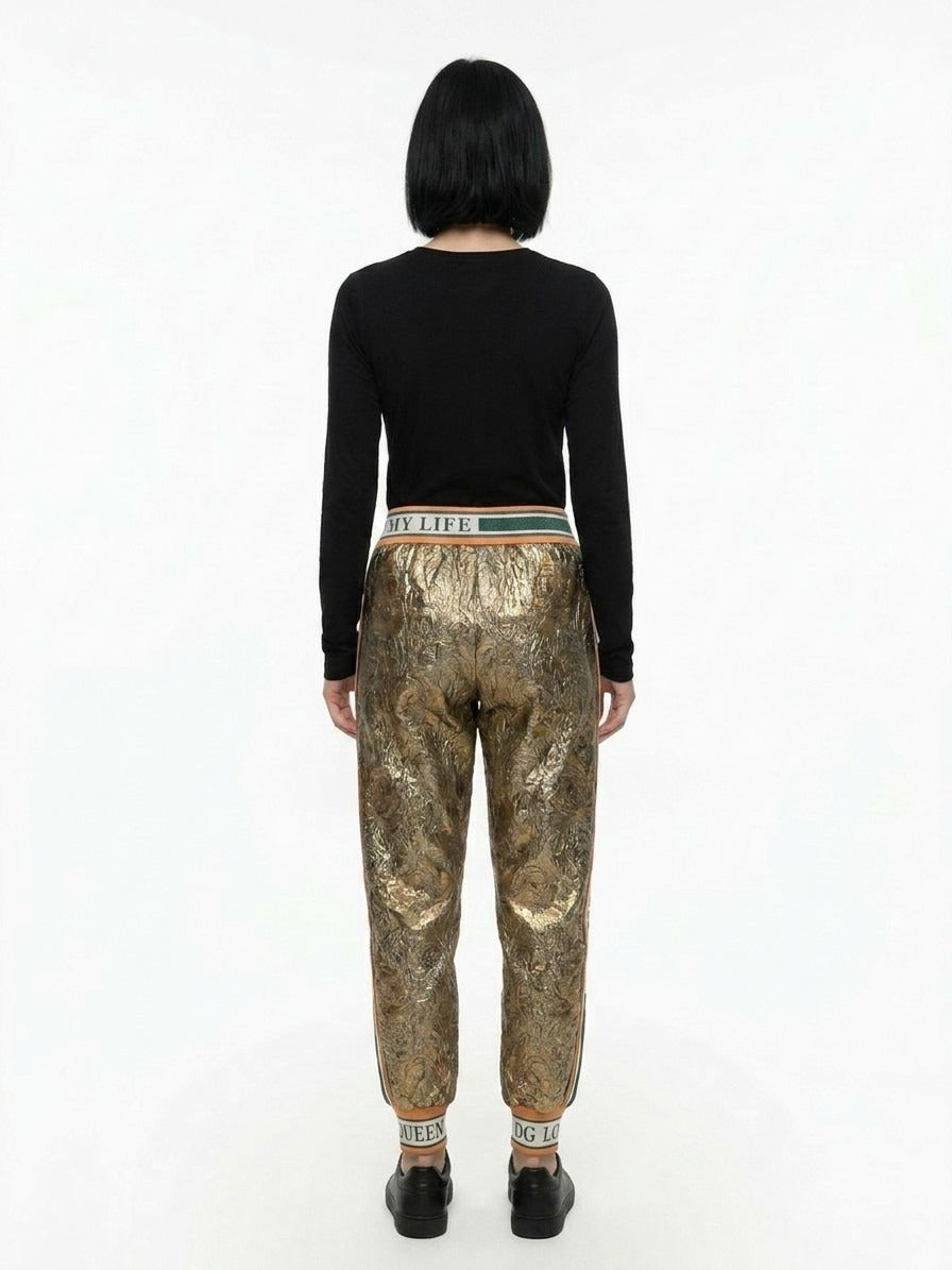 Trousers by Dolce & Gabbana for women in polyester silk & wool gold features an on trend silhouette, showcasing a sophisticated with a long and for an on trend finish.