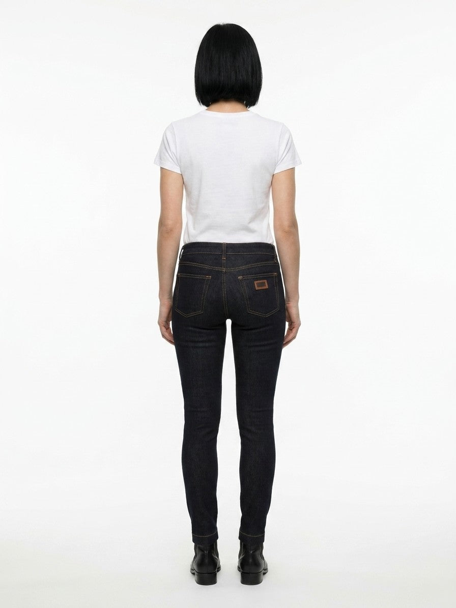 Jeans by Dolce & Gabbana for women in stretch denim cotton blue features a polished silhouette with a polished skinny, reaching a polished long and finished with a polished .