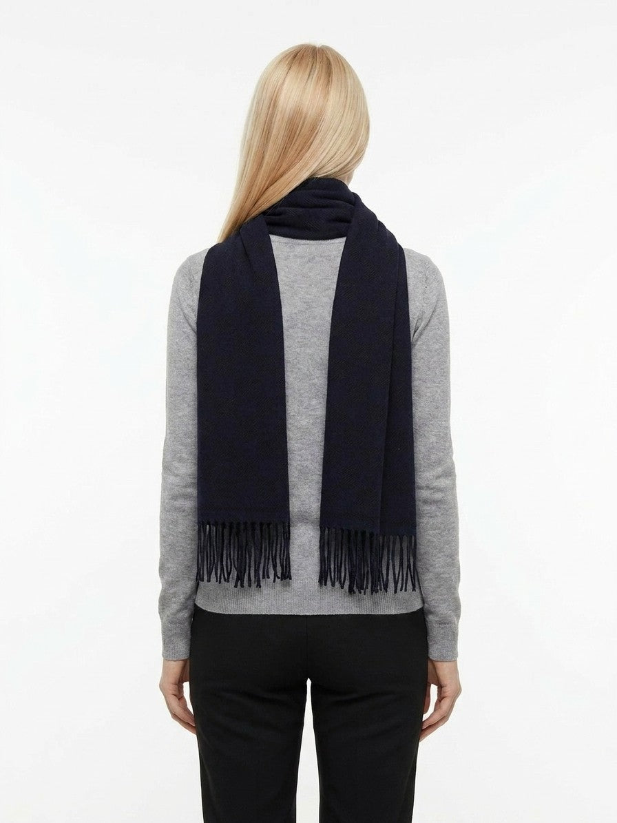 Scarf by Givenchy for women in wool bicolour & signature showcases a warm silhouette from the Wool Wrap Scarf collection, offering a warm drape that exudes sophisticated luxury.