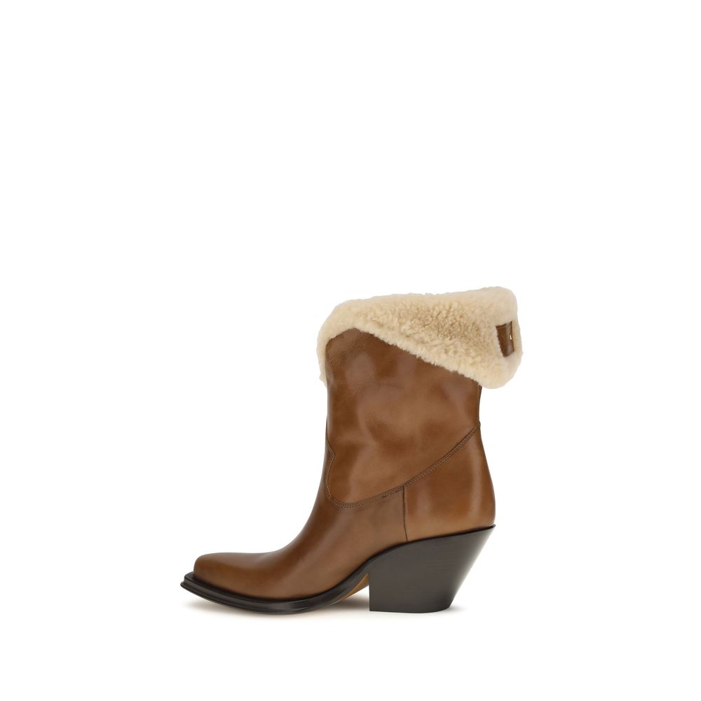 Ankle Cowboy Boots by Chloé for women in bost taurus calf leather & fur brown features an effortless chic silhouette from the Women's Bost Taurus Calf Leather & Fur Ankle Cowboy Boots collection, showcasing a effortless chic block-heel and refined pointed toe style for an effortless chic look.