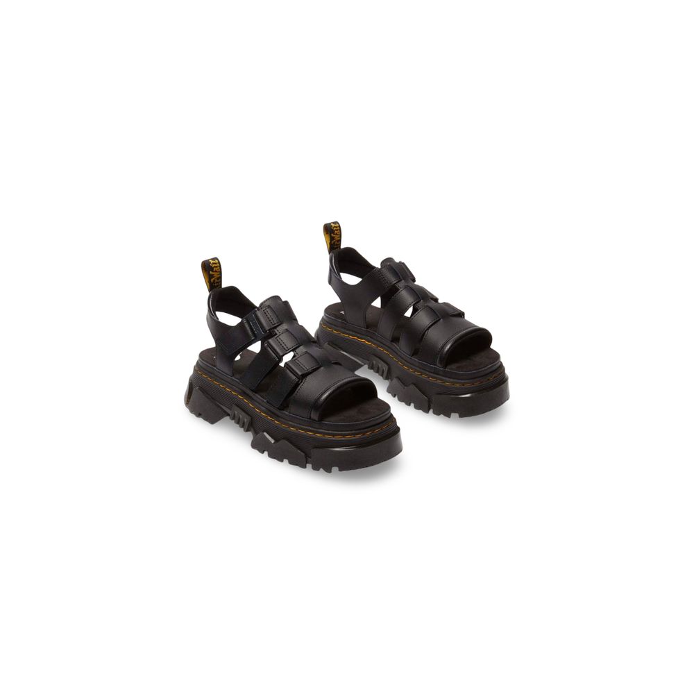 Platform Sandals by Dr. Martens for women in leather black features an effortlessly chic silhouette from the Women's Leather Platform Sandals collection, showcasing a effortlessly chic platform and elegant .