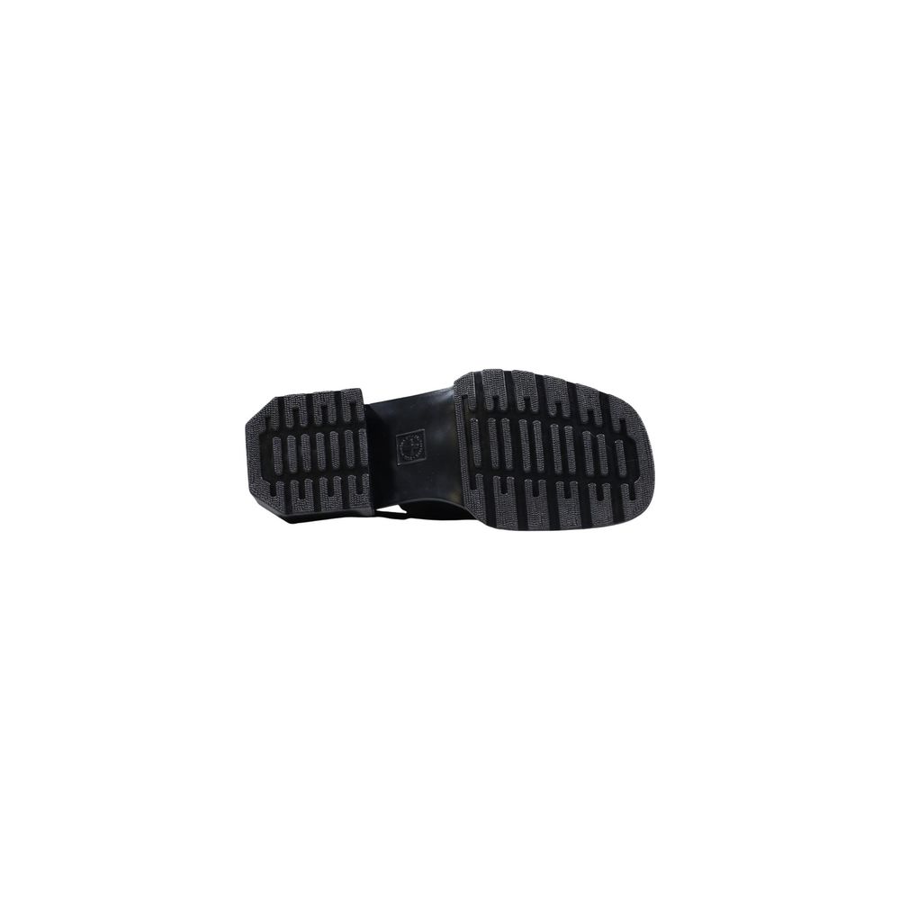 Mules Sandals Flat Shoes by Dr. Martens for women in leather black showcases a enchanting silhouette as part of the Women's Leather Mules Sandals Flat Shoes collection, defined by a enchanting and for a enchanting look.