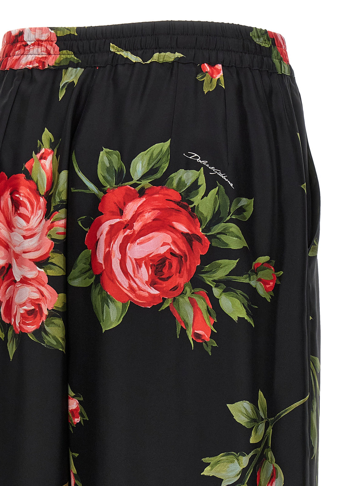 Trousers by Dolce & Gabbana for women in silk twill black, rose, signature & print features a tailored silhouette with a tailored straight-leg & wide, defined by its long and a sophisticated .