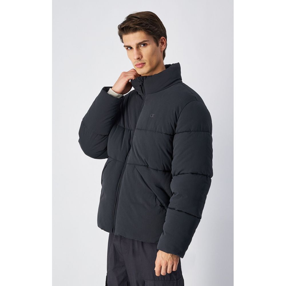 Parka by Champion for men in polyamide black, presenting a cosy silhouette with distinctive insulated and a refined .