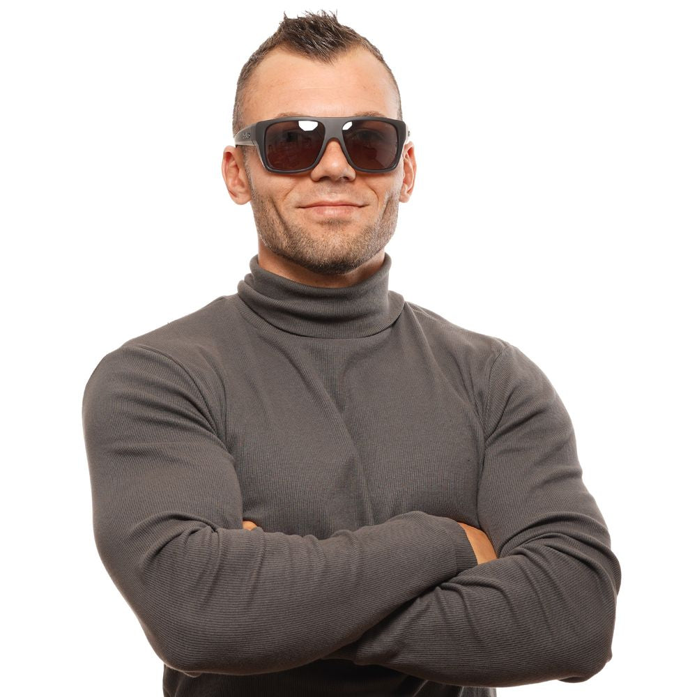 This Sunglasses by Bolle for unisex in black presents a sumptuous silhouette, showcasing a sumptuous rectangle full-rim frame design in black coloured frame and high-performance polarized category-3-dark-tint lens.