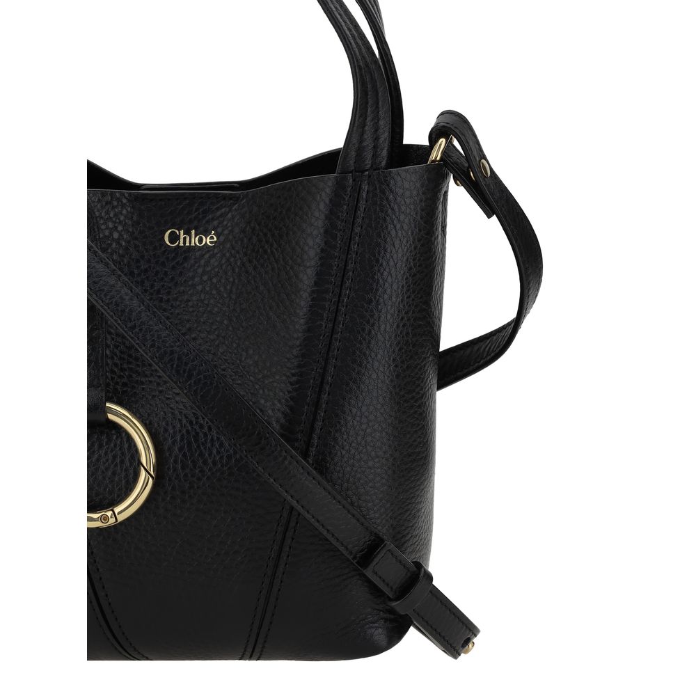 Shoulder Bag by Chloé for women in grained horse leather black & monogram features a stately silhouette, showcasing a secure magnetic & button, ample single-compartment, and stately shoulder-strap, handle & adjustable-strap for a stately finish.