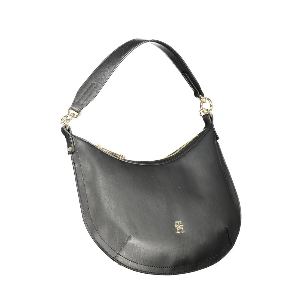 Handbag by Tommy Hilfiger for women in polyethylene black & signature features a refined silhouette, showcasing a secure zipper, organized internal-pockets, and versatile shoulder-strap, adjustable-strap & handle for a refined finish.