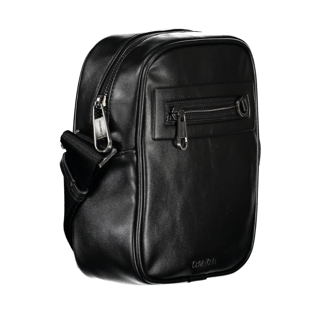 Shoulder Bag by Calvin Klein for men in polyester & polyethylene black presents a statuesque silhouette, showcasing a secure zipper and statuesque external-pockets & internal-pockets with versatile shoulder-strap & adjustable-strap for a sophisticated look.