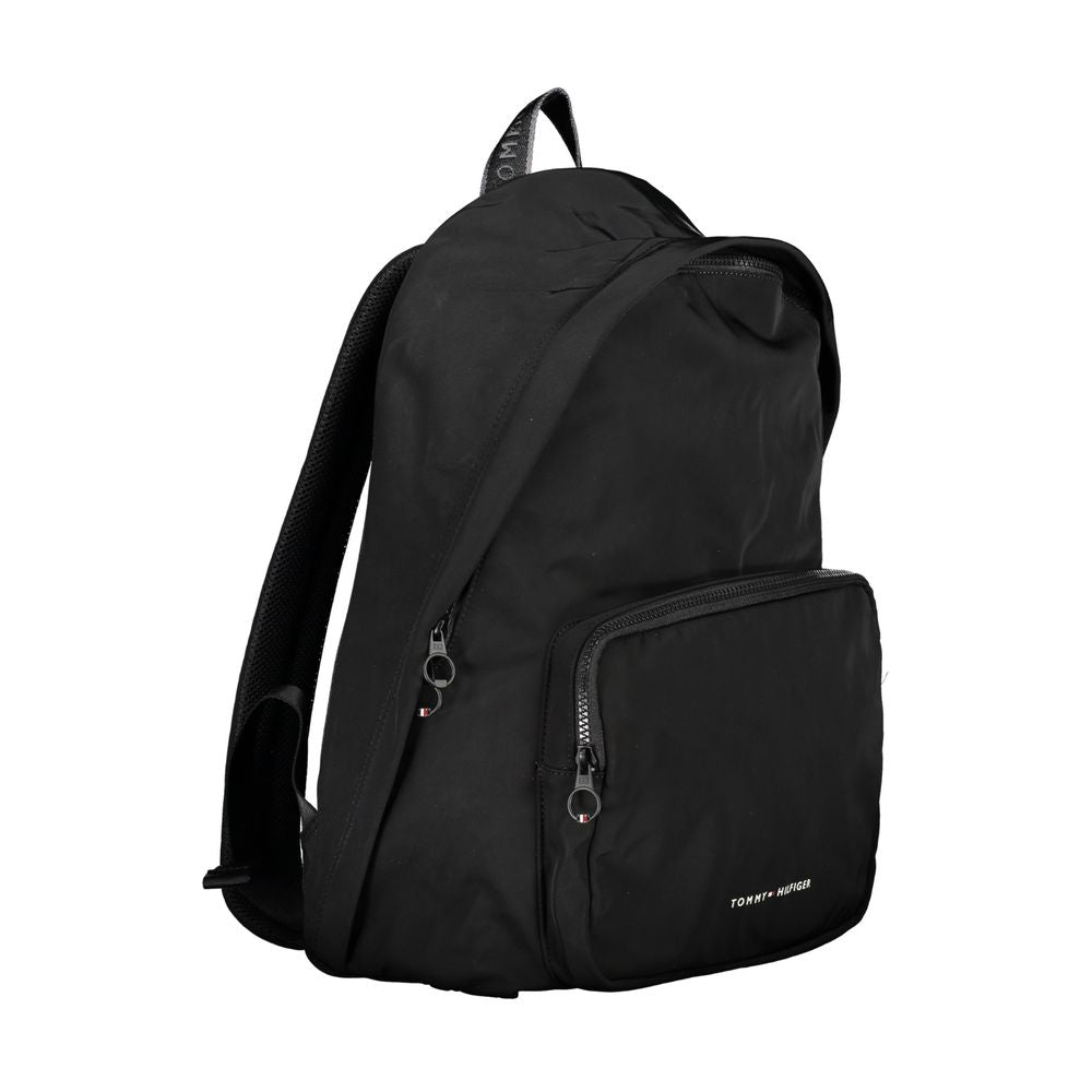 Travel Backpack by Tommy Hilfiger for men in polyester black presents a stately City Polyester Travel Backpack design, showcasing a secure zipper with ample external-pockets, internal-pockets & laptop-compartment and versatile handle, backpack-strap & adjustable-strap for a stately finish.